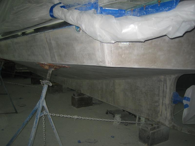 APRIL 22, 2009 004.jpg - Photo shows that they leave very little fairing material on the boat before painting.